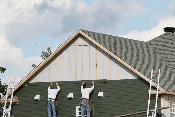 Professional Vinyl Siding technician working in Slickville, PA